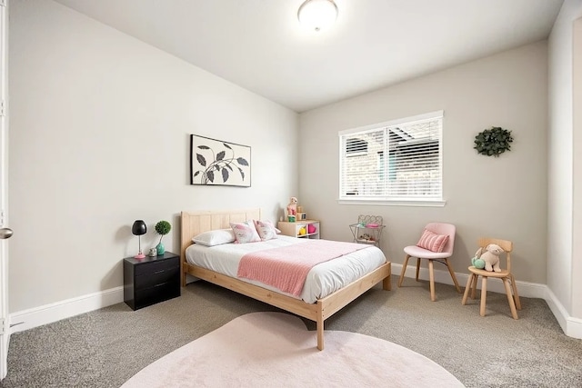 bedroom with carpet floors and baseboards