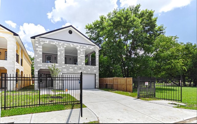 view of front facade with a garage and a front yard