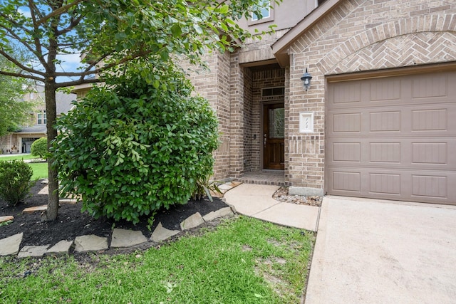 114 Kohen Ct, Montgomery, TX 77316 - property entrance featuring brick siding and a garage
