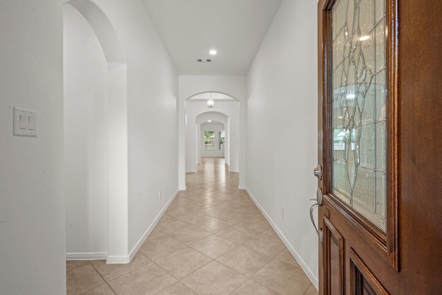 114 Kohen Ct, Montgomery, TX 77316 - hallway with arched walkways, light tile patterned floors, baseboards, and recessed lighting