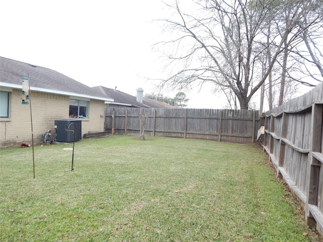 view of yard with central air condition unit