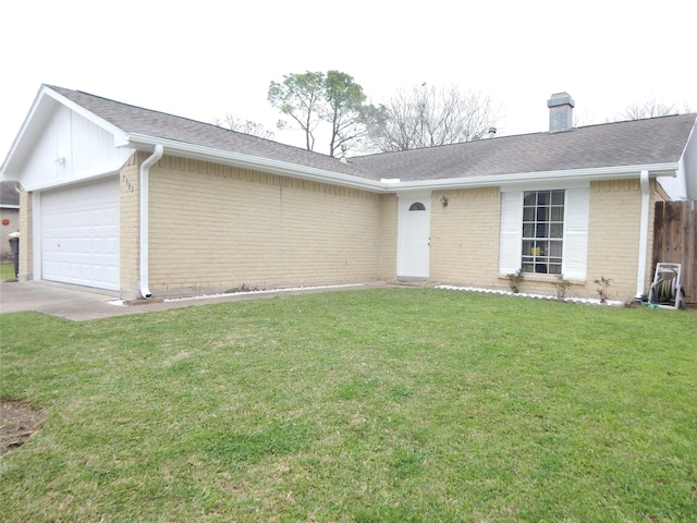 ranch-style house featuring a garage and a front lawn