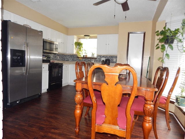 dining area with ceiling fan and dark hardwood / wood-style flooring