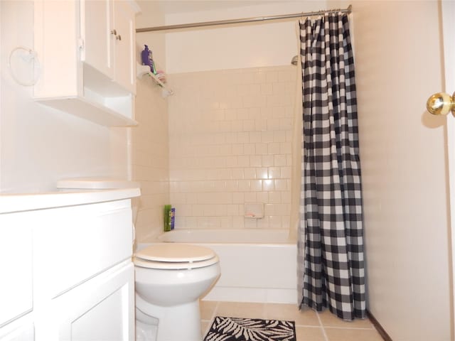 bathroom with tile patterned flooring, shower / bath combination with curtain, and toilet