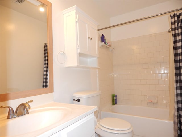 full bathroom with vanity, shower / bath combination with curtain, and toilet