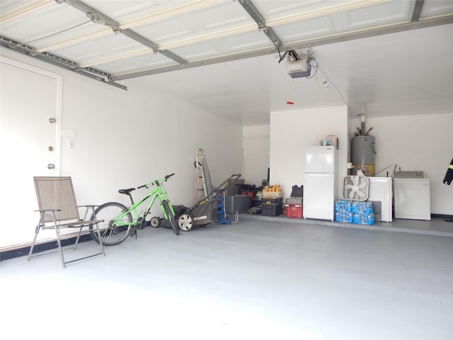 garage with white refrigerator, washer / dryer, a garage door opener, and water heater