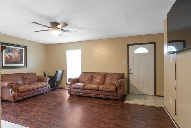 living room featuring wood finished floors and ceiling fan