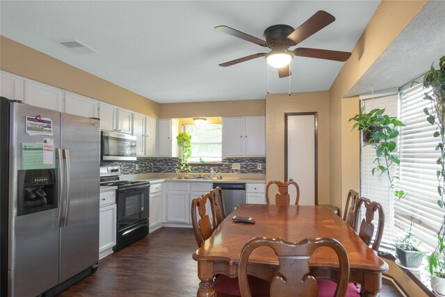 kitchen featuring light countertops, ceiling fan, stainless steel appliances, tasteful backsplash, and white cabinetry