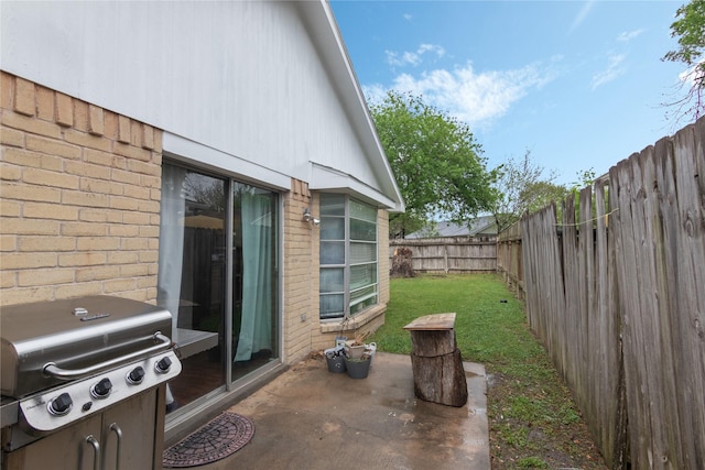 view of patio / terrace featuring a fenced backyard and area for grilling