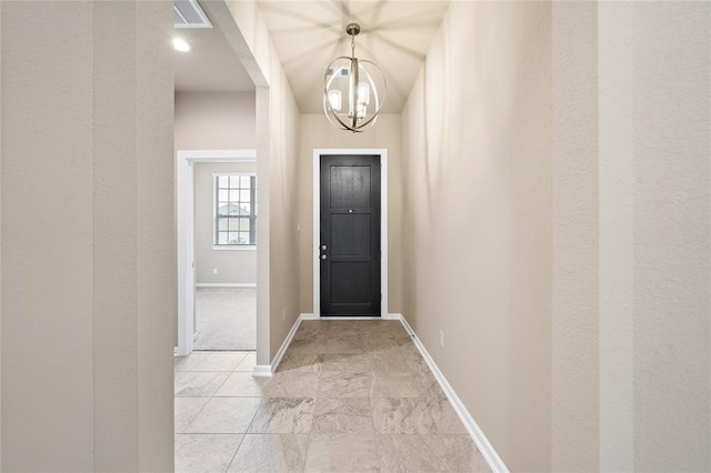 foyer entrance with an inviting chandelier