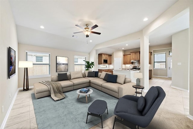 tiled living room with vaulted ceiling and ceiling fan