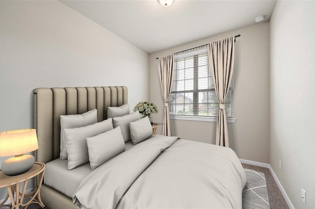 bedroom with vaulted ceiling and carpet flooring