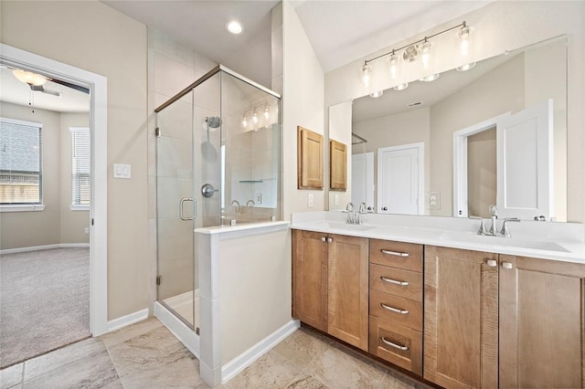 bathroom with an enclosed shower and vanity