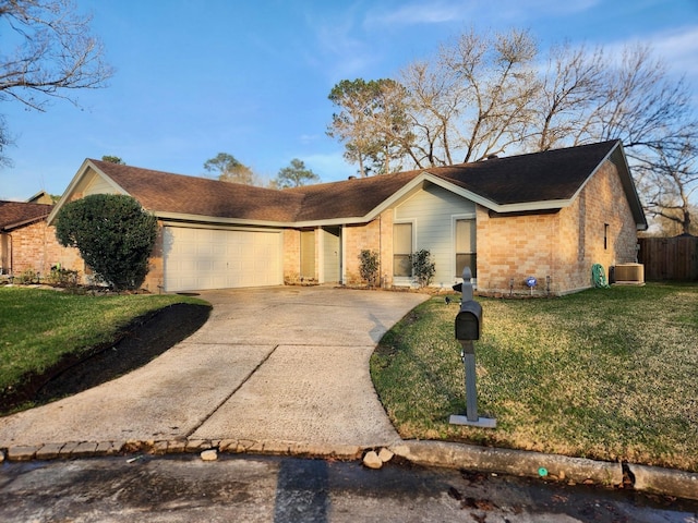 ranch-style home with brick siding, a front lawn, concrete driveway, cooling unit, and an attached garage