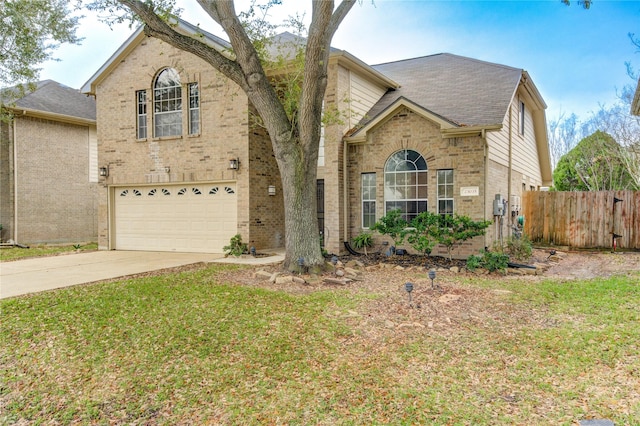 view of front property featuring a garage and a front yard