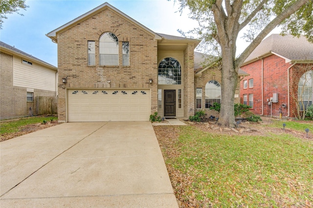 front of property with a garage and a front lawn