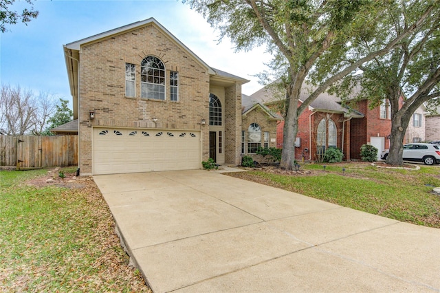 view of front of property featuring a garage and a front yard