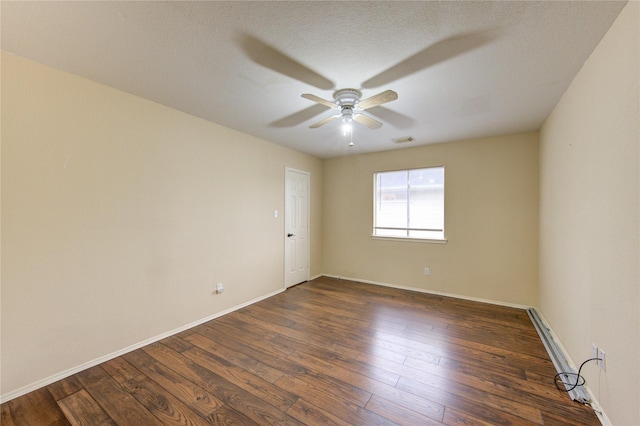 unfurnished room featuring dark wood-type flooring and ceiling fan