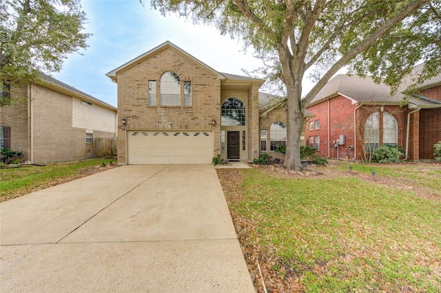 view of property featuring a garage and a front yard