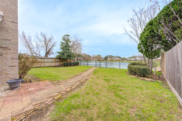 view of yard with a water view