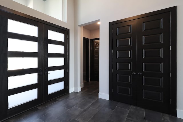 entryway featuring french doors and baseboards