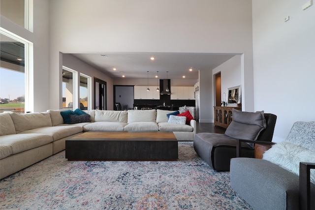 living area with a high ceiling