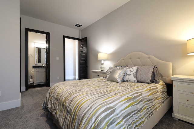 bedroom with dark carpet, visible vents, and baseboards