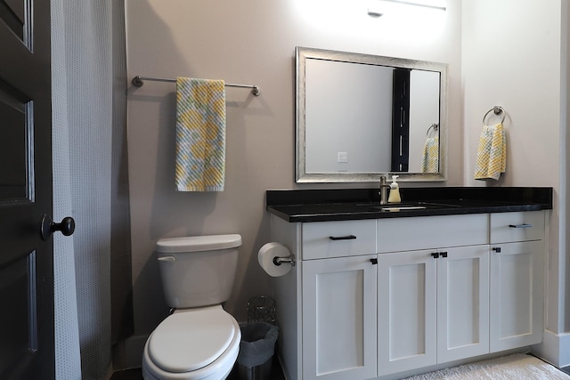 full bathroom with vanity and toilet