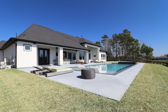 rear view of property with a patio, a shingled roof, a yard, french doors, and an outdoor pool