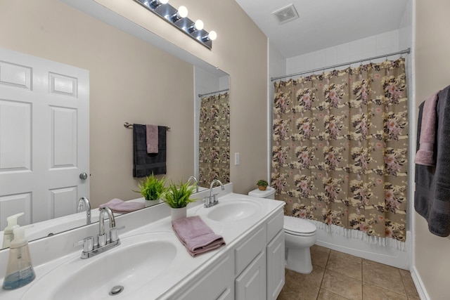 full bathroom featuring tile patterned flooring, visible vents, a sink, and double vanity