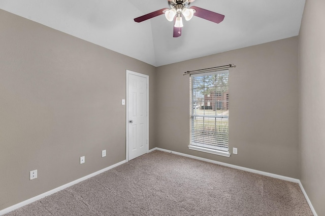 unfurnished room featuring lofted ceiling, carpet floors, ceiling fan, and baseboards