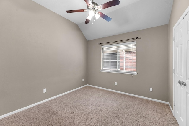 unfurnished room with vaulted ceiling, ceiling fan, carpet, and baseboards