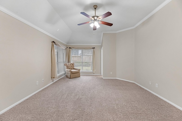 unfurnished room featuring carpet, crown molding, a ceiling fan, vaulted ceiling, and baseboards