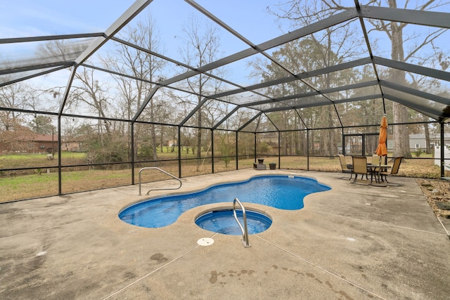 view of swimming pool with a lanai, a patio area, and an in ground hot tub