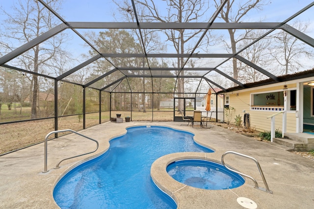 view of swimming pool with a lanai, a patio, and an in ground hot tub