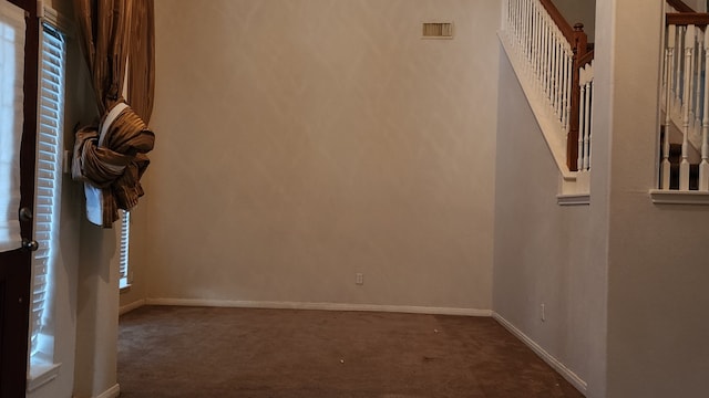 unfurnished room with carpet floors