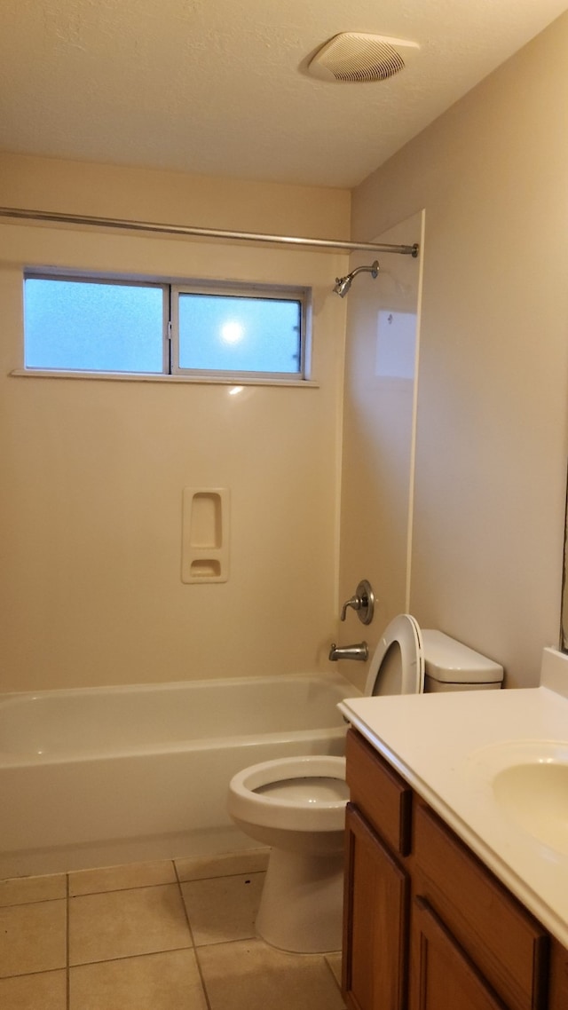 full bathroom featuring tile patterned flooring, vanity, toilet, and shower / bathing tub combination