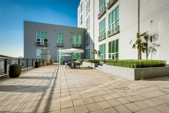 view of property's community with a patio area