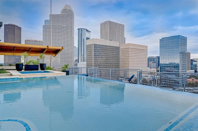 view of swimming pool featuring a view of city