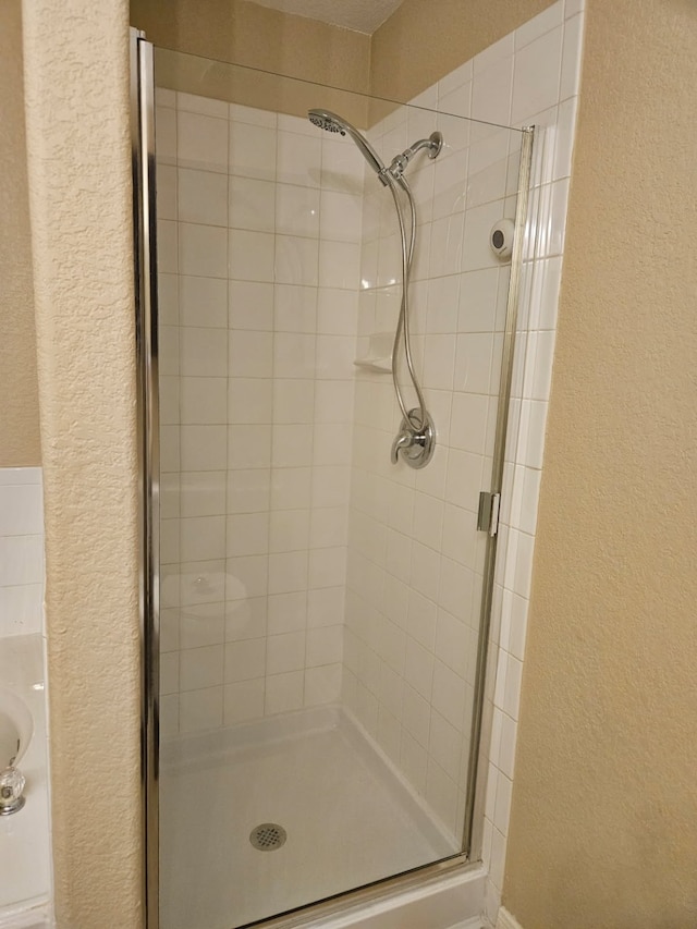 bathroom with an enclosed shower