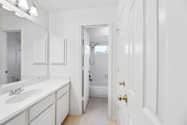 full bath with toilet, vanity, baseboards, bathing tub / shower combination, and tile patterned floors