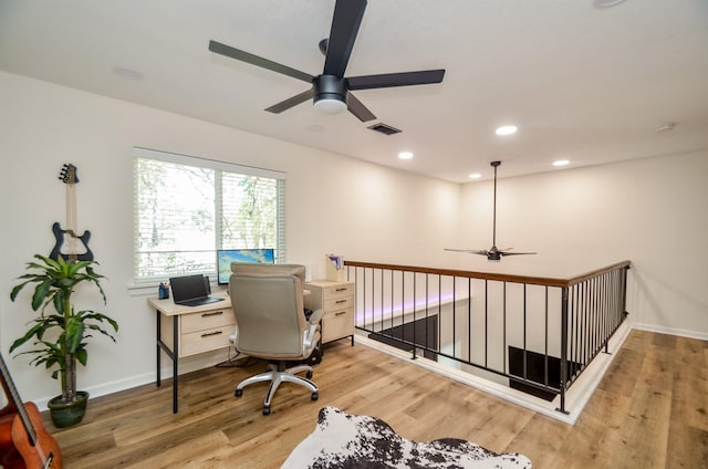 office area featuring baseboards, light wood-type flooring, visible vents, and recessed lighting