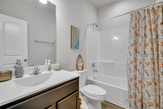 bathroom with wood finished floors, vanity, toilet, and shower / bath combo with shower curtain