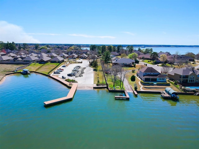 birds eye view of property with a residential view and a water view