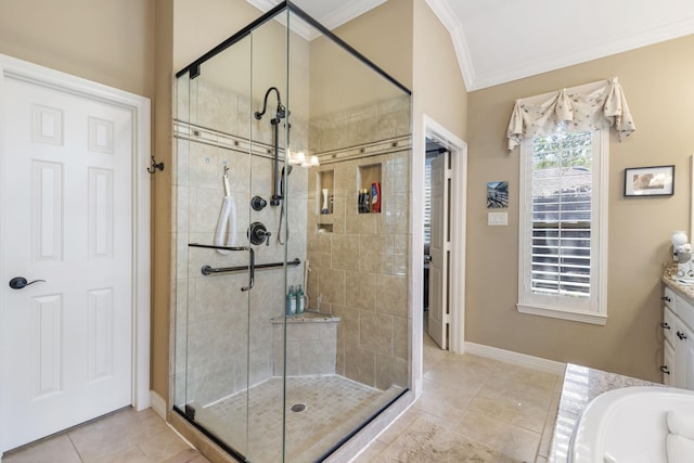 bathroom featuring independent shower and bath, crown molding, tile patterned flooring, and vanity