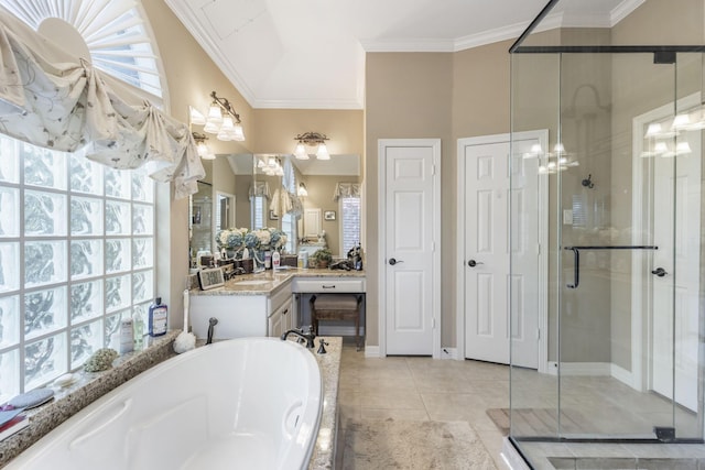 bathroom with tile patterned floors, ornamental molding, shower with separate bathtub, and vanity