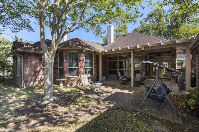 back of property featuring a patio area and ceiling fan