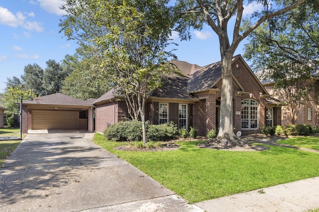 view of front facade with a garage and a front yard