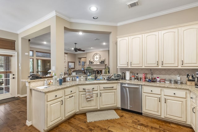 kitchen featuring sink, dishwasher, light stone counters, dark hardwood / wood-style flooring, and kitchen peninsula