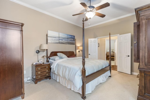 bedroom featuring ornamental molding, connected bathroom, light colored carpet, and ceiling fan